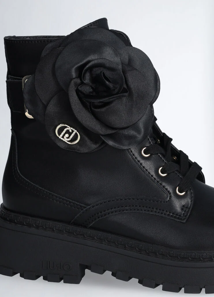 Leather combat boots with flower detail