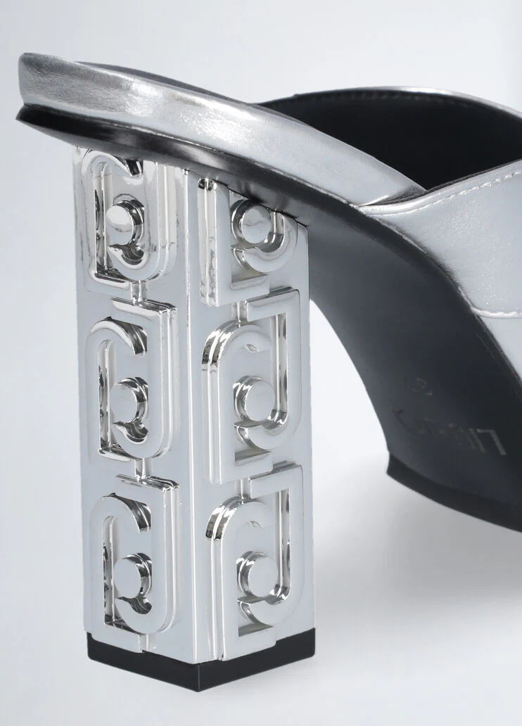 Sandals with branded heel