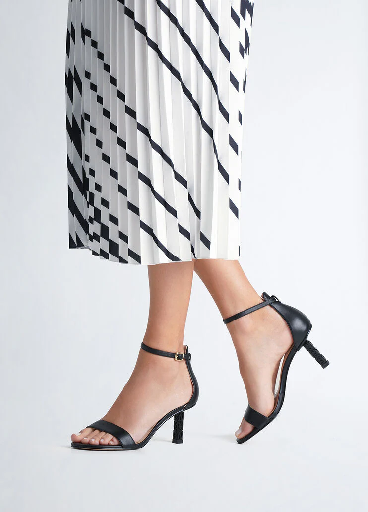 Sandals with branded heel