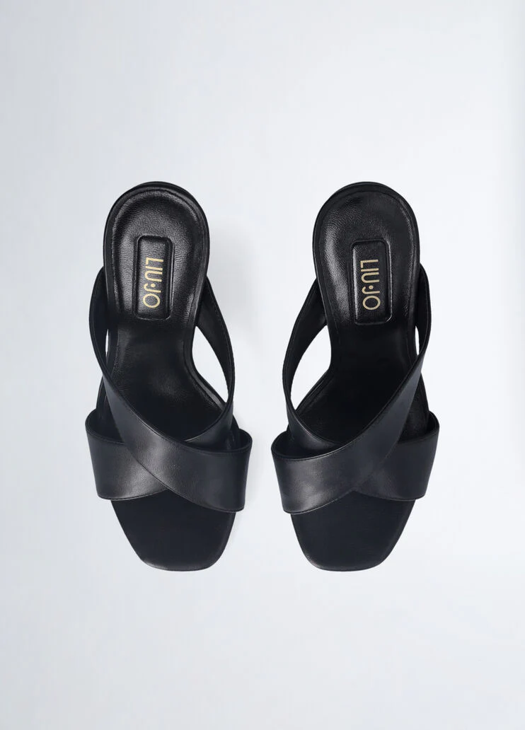 Sandals with branded heel