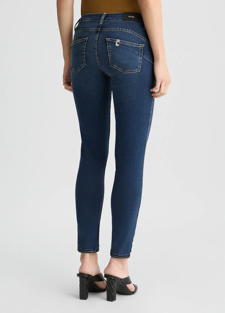Dark blue skinny jeans with slit