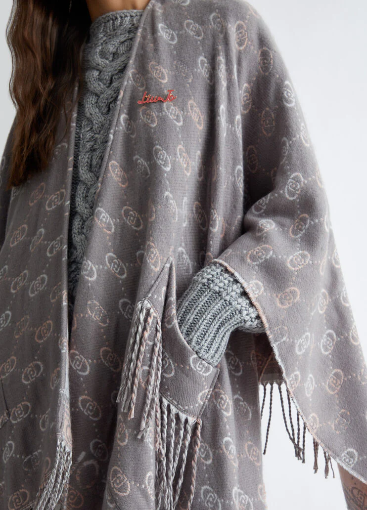 Poncho with jacquard logo