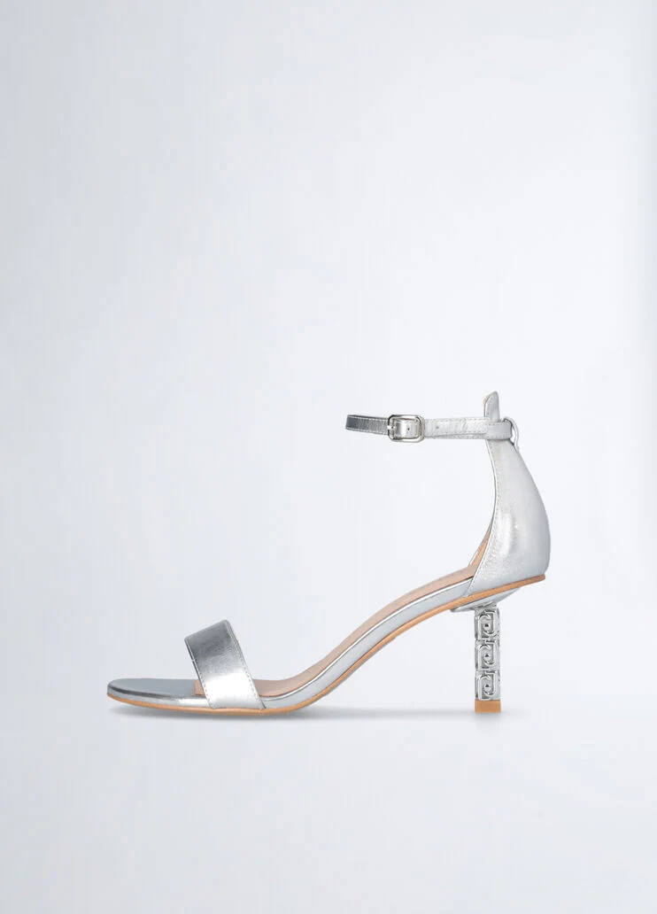 Sandals with branded heel