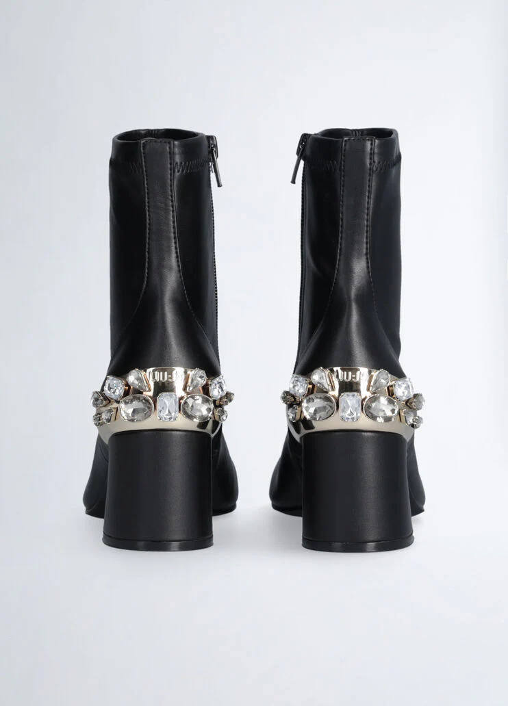 Black ankle boots with bejewelled gemstones