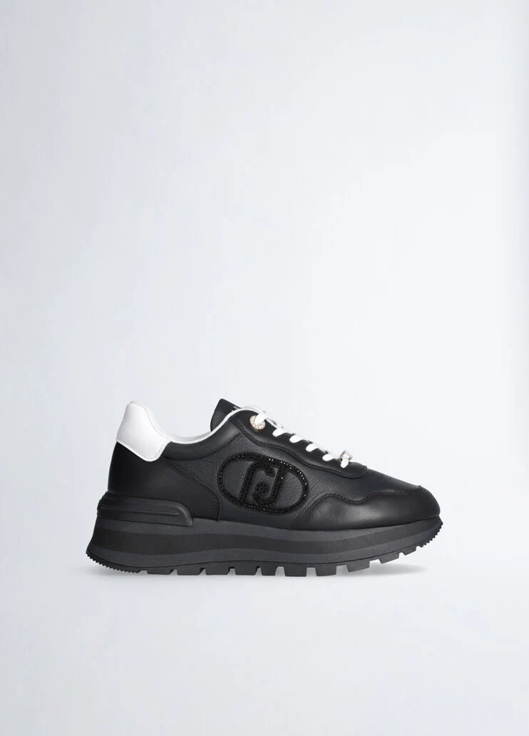 Black leather sneakers with bejewelled logo