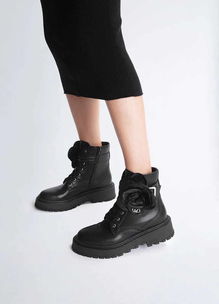 Leather combat boots with flower detail