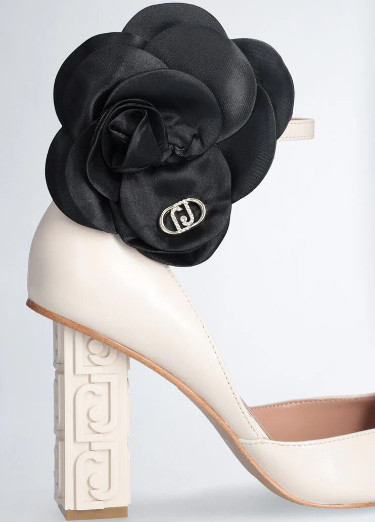 White court shoes with flower detail