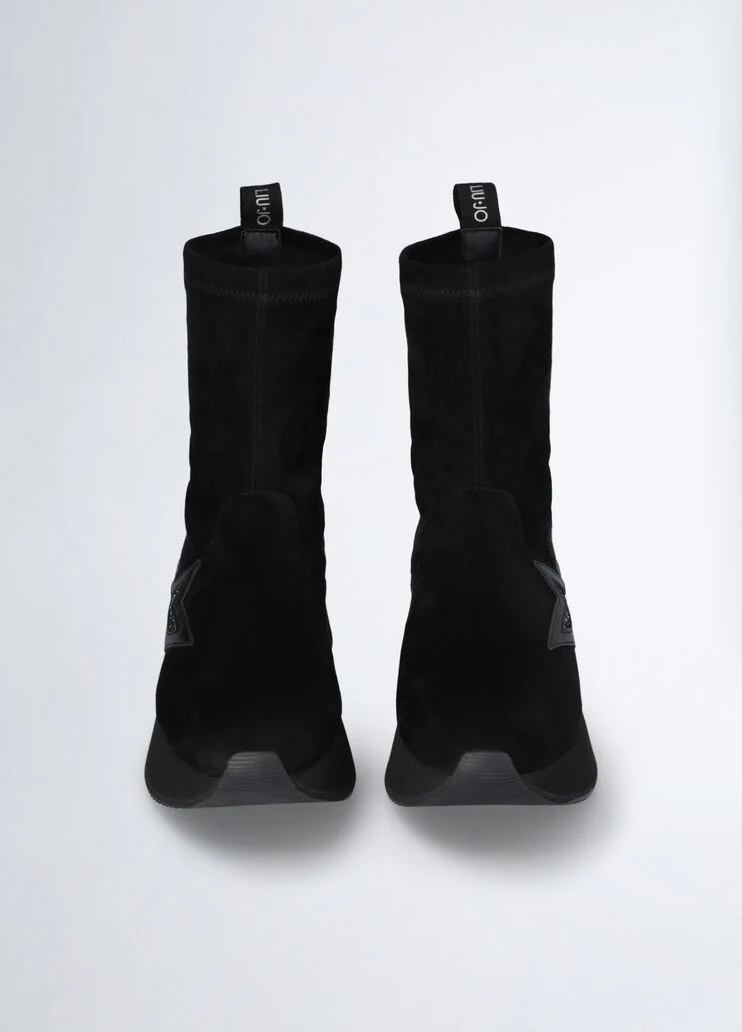 Black ankle boots with glittery star