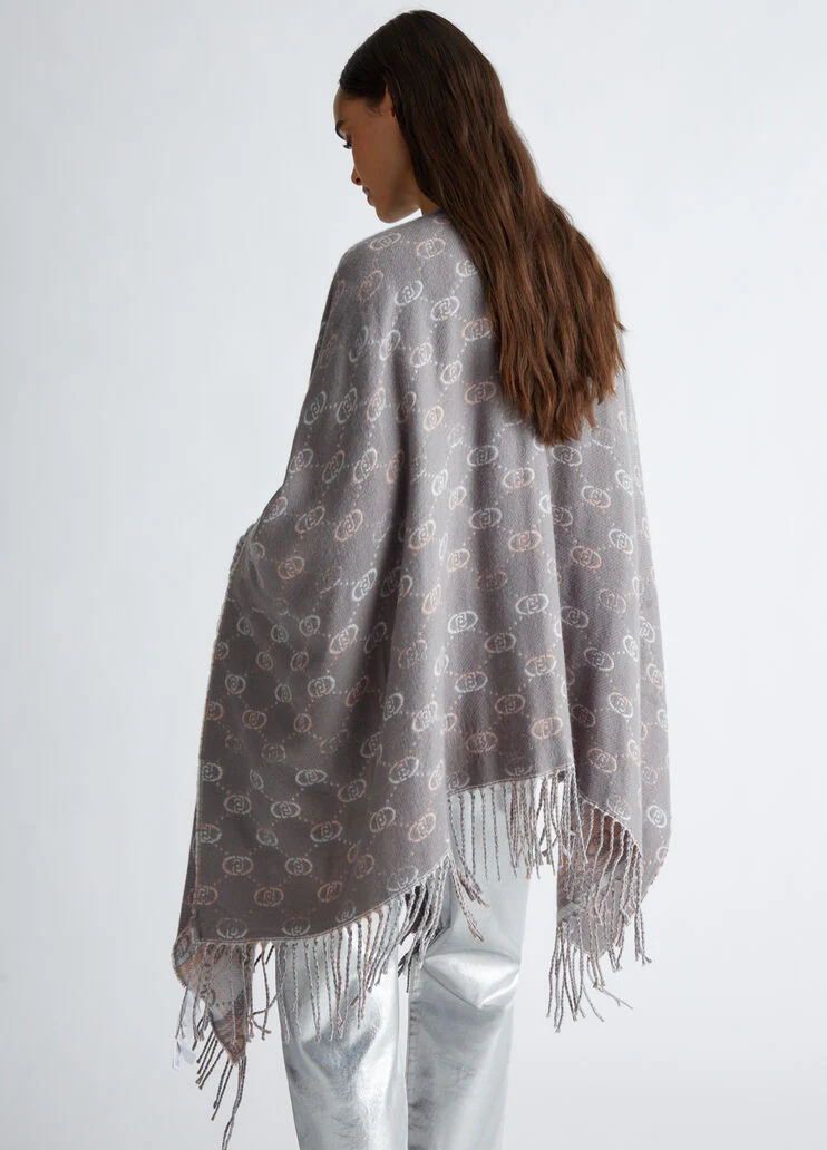Poncho with jacquard logo