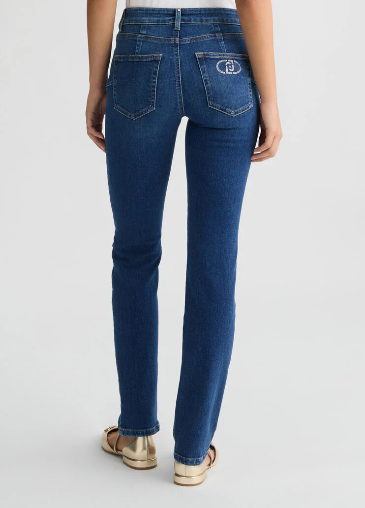 Dark slim-fit jeans with rhinestones