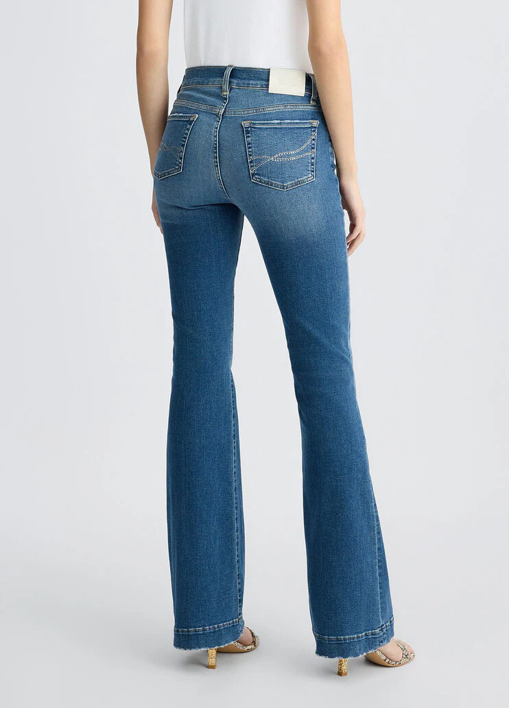 Blue bell-bottom jeans with rhinestones