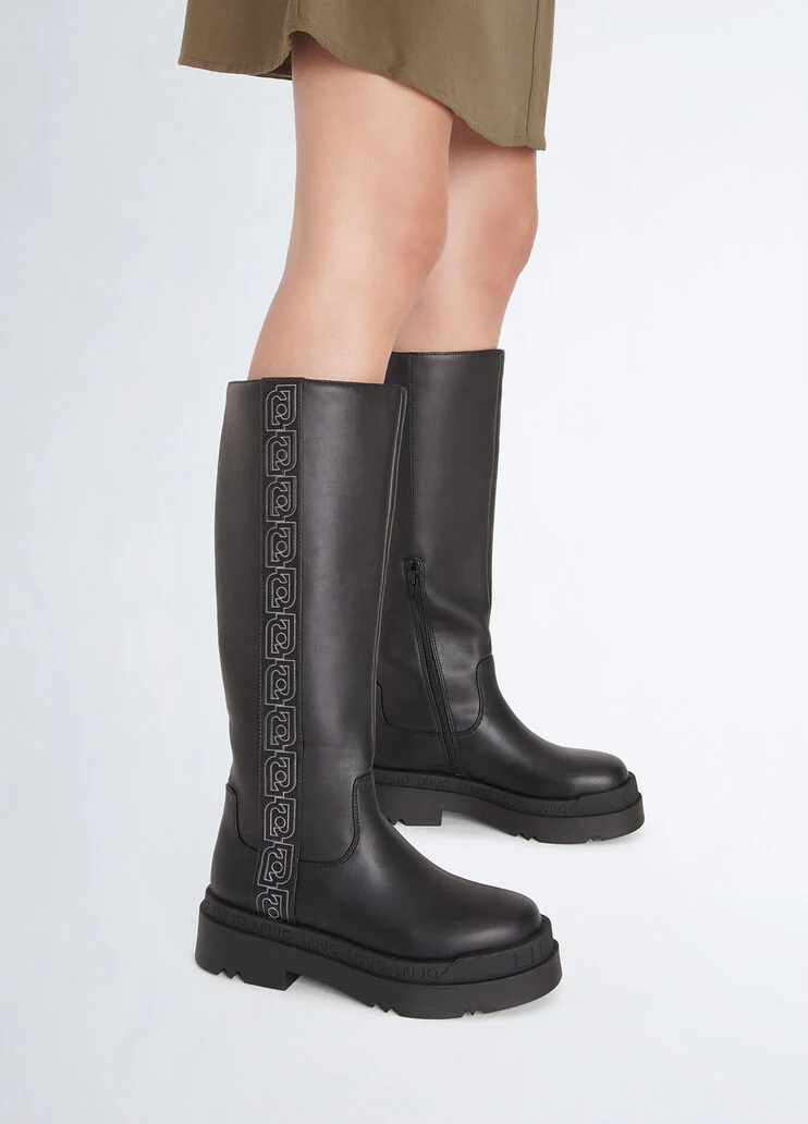 Black platform boots with logo