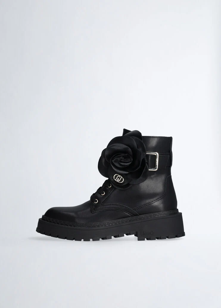 Leather combat boots with flower detail