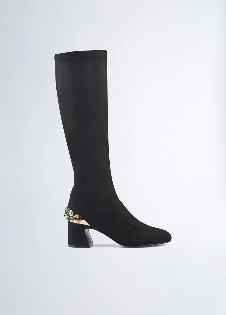 Knee-high boots with bejewelled gemstones