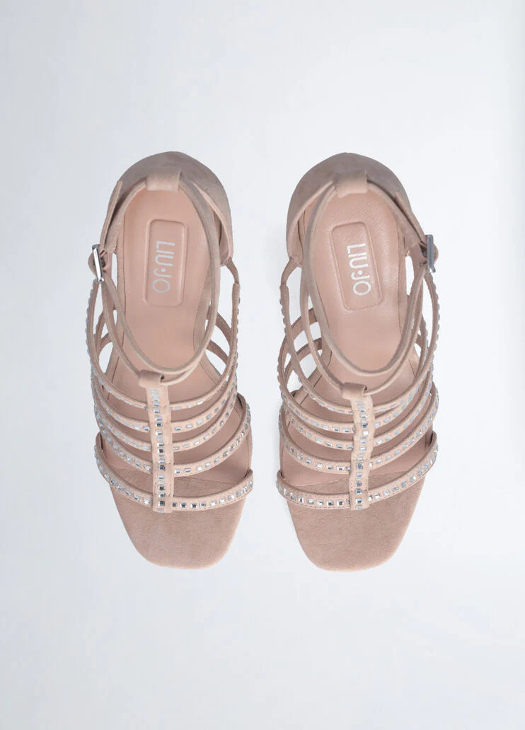 Sandals with branded heel