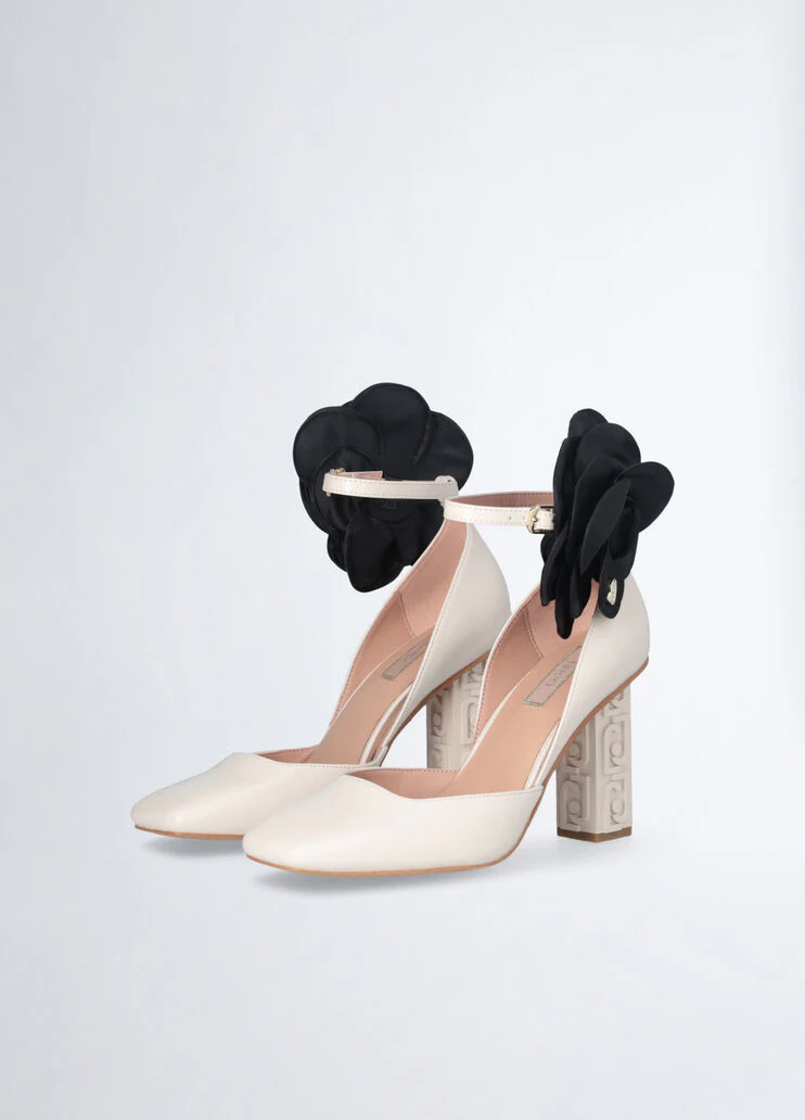 White court shoes with flower detail