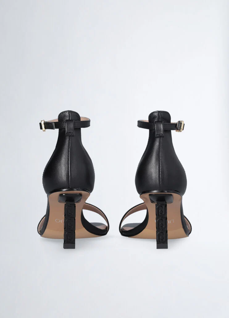 Sandals with branded heel