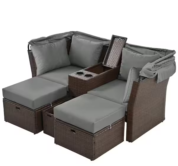 Rattan outdoor patio sofa bed with cushions, folding awning, cup holder and storage box