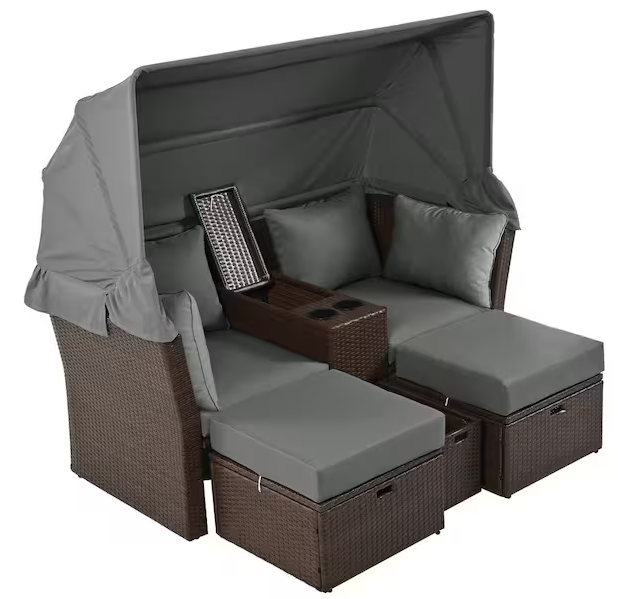 Rattan outdoor patio sofa bed with cushions, folding awning, cup holder and storage box