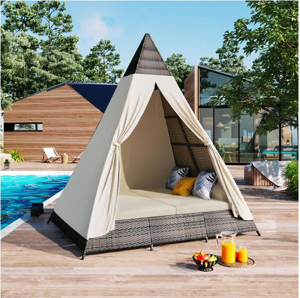 Brown Wicker Outdoor Day Bed with Beige Cushions and Colorful Pillows in Tent Shape