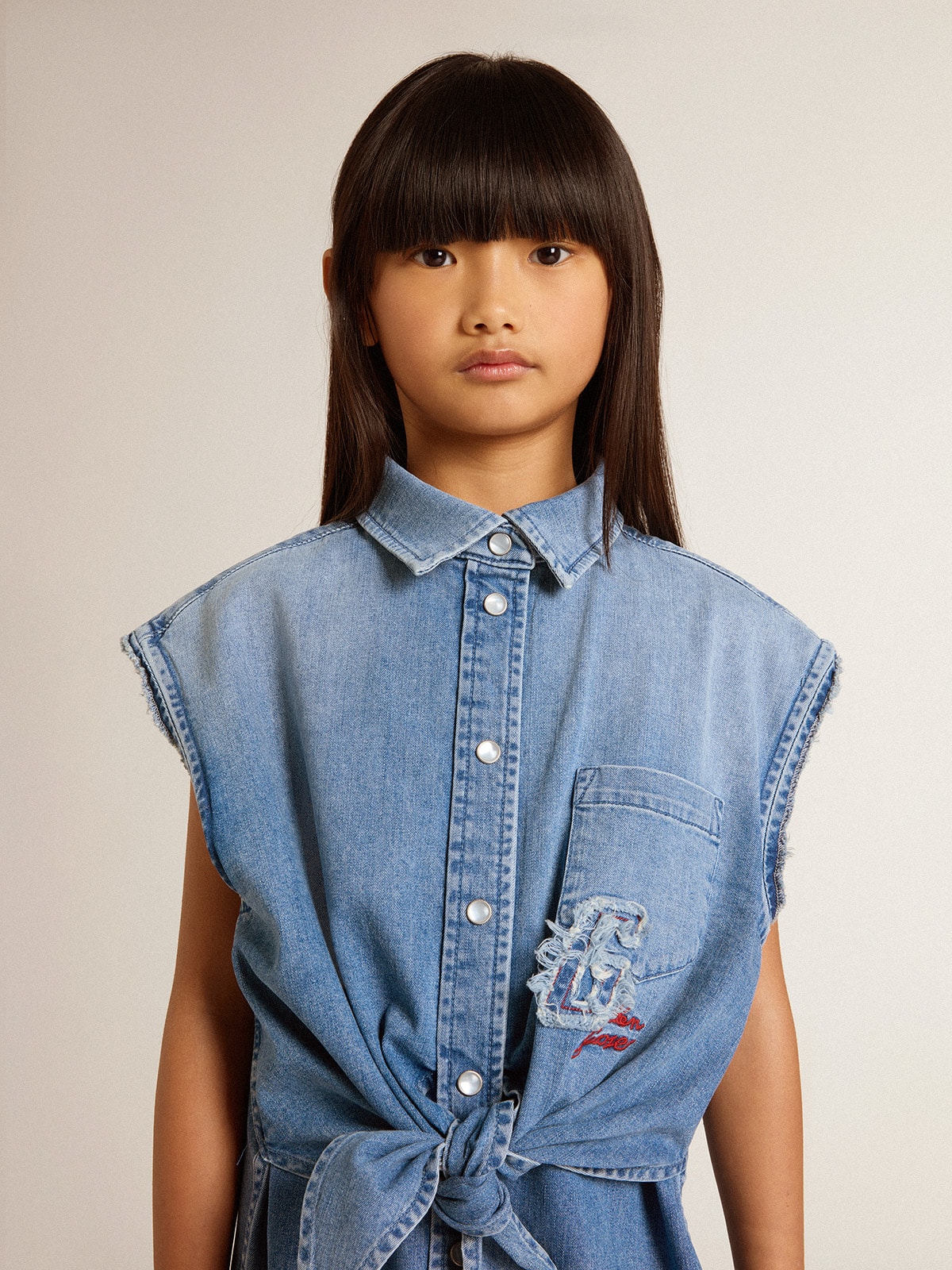 Girls' denim dress with front knot and embroidery