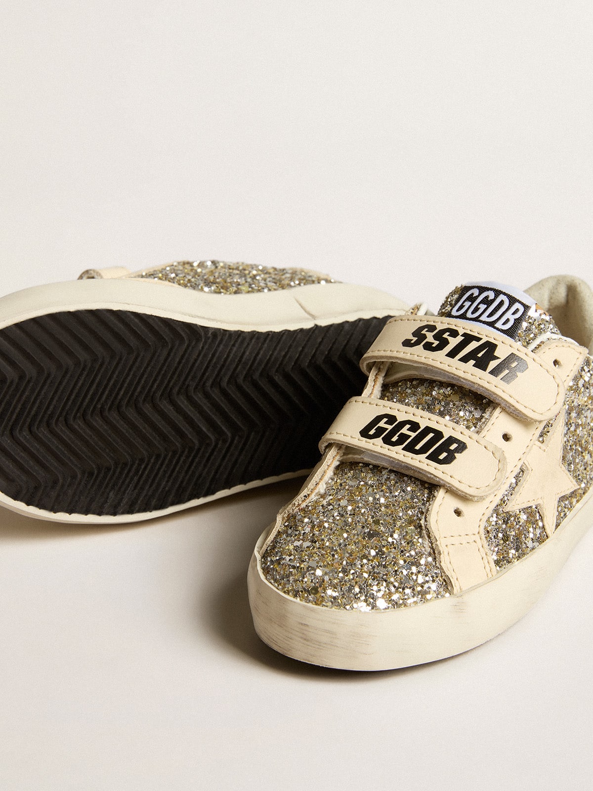 Young Old School in platinum glitter with leather star and heel tab