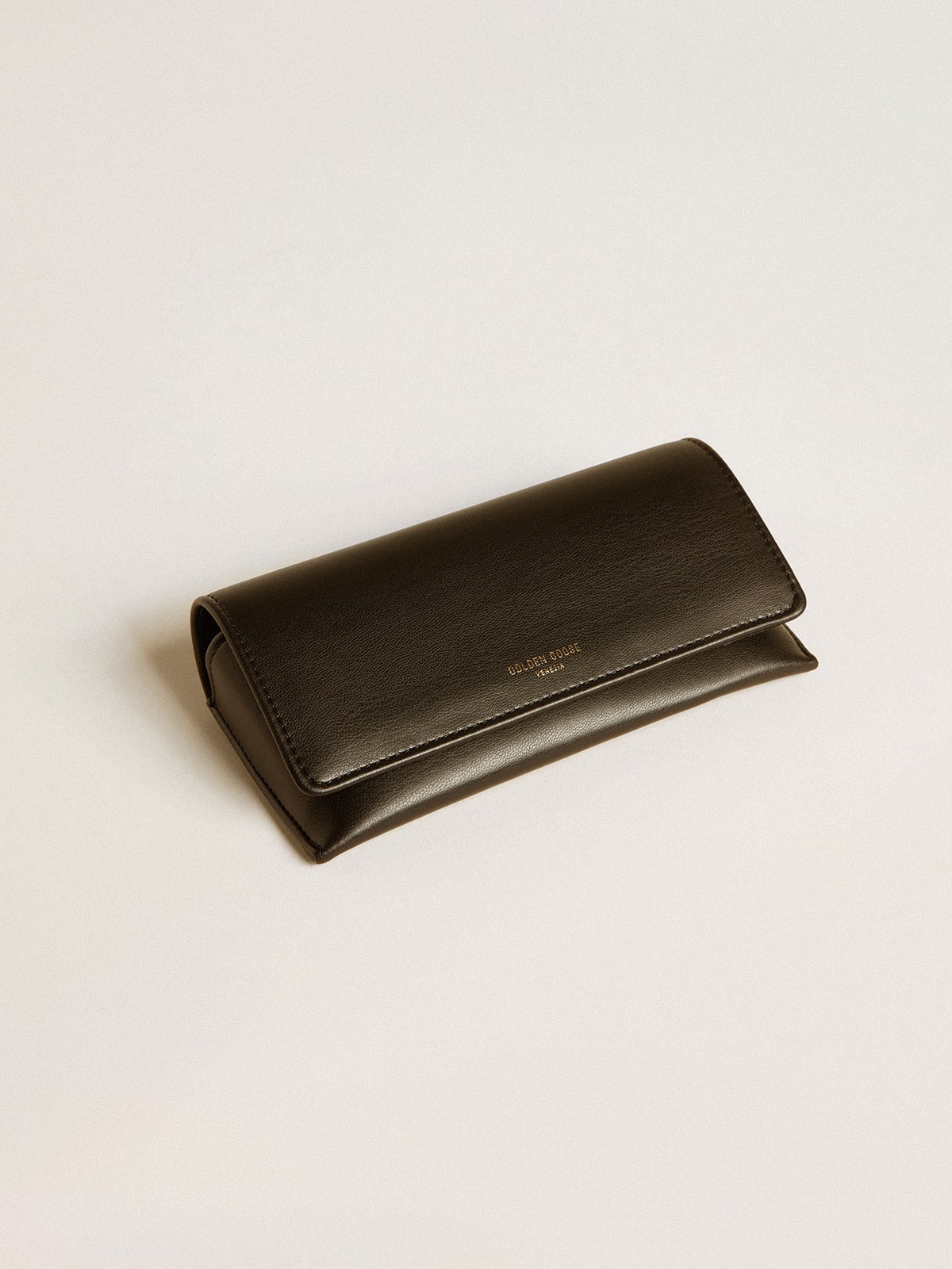 Aviator style sunglasses with tortoiseshell frame and green lenses