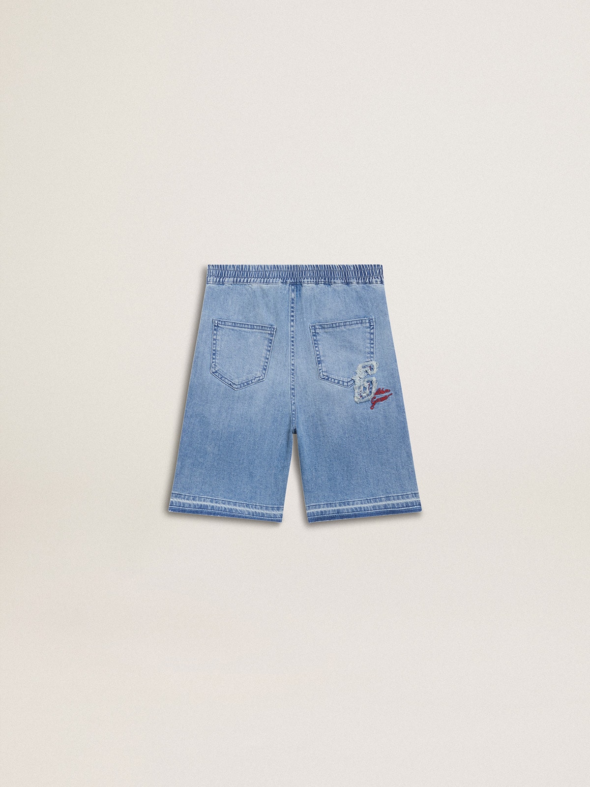 Kids’ denim shorts with embroidery on the back