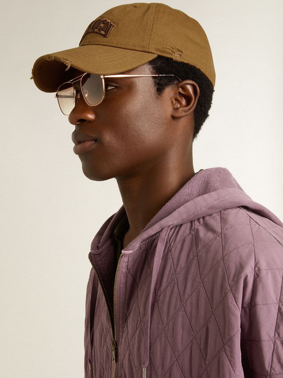 Beige cotton baseball cap with a lived-in finish