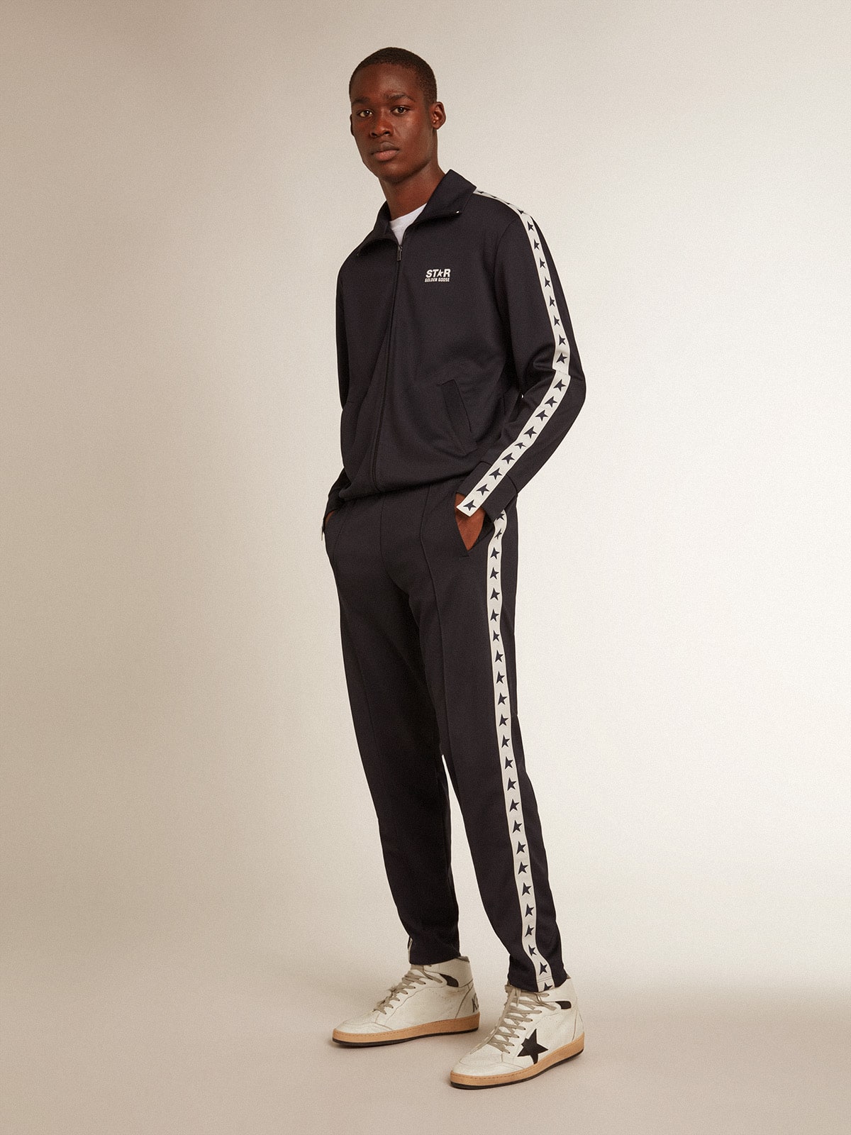 Dark blue sweatshirt with white strip and contrasting blue stars