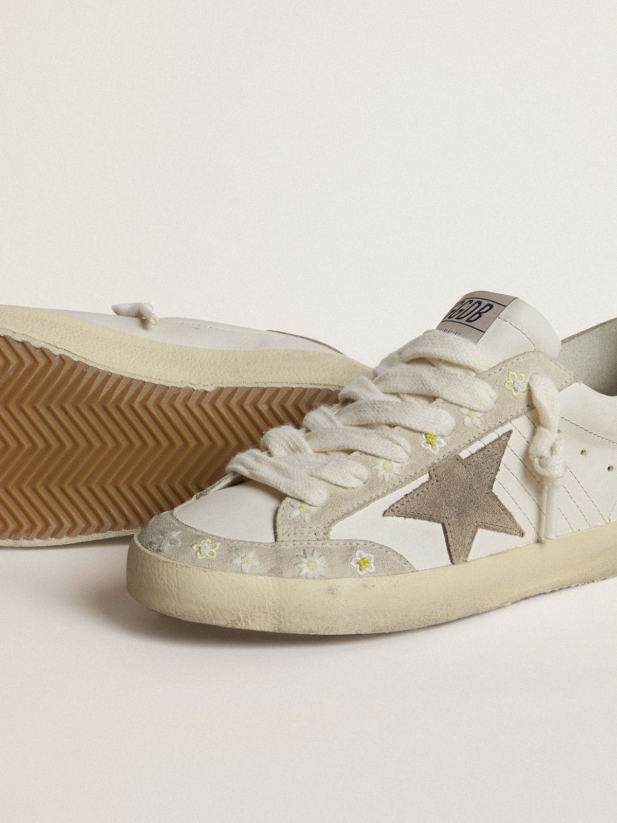 Women’s Super-Star LTD with beige suede star and heel tab and floral embroidery