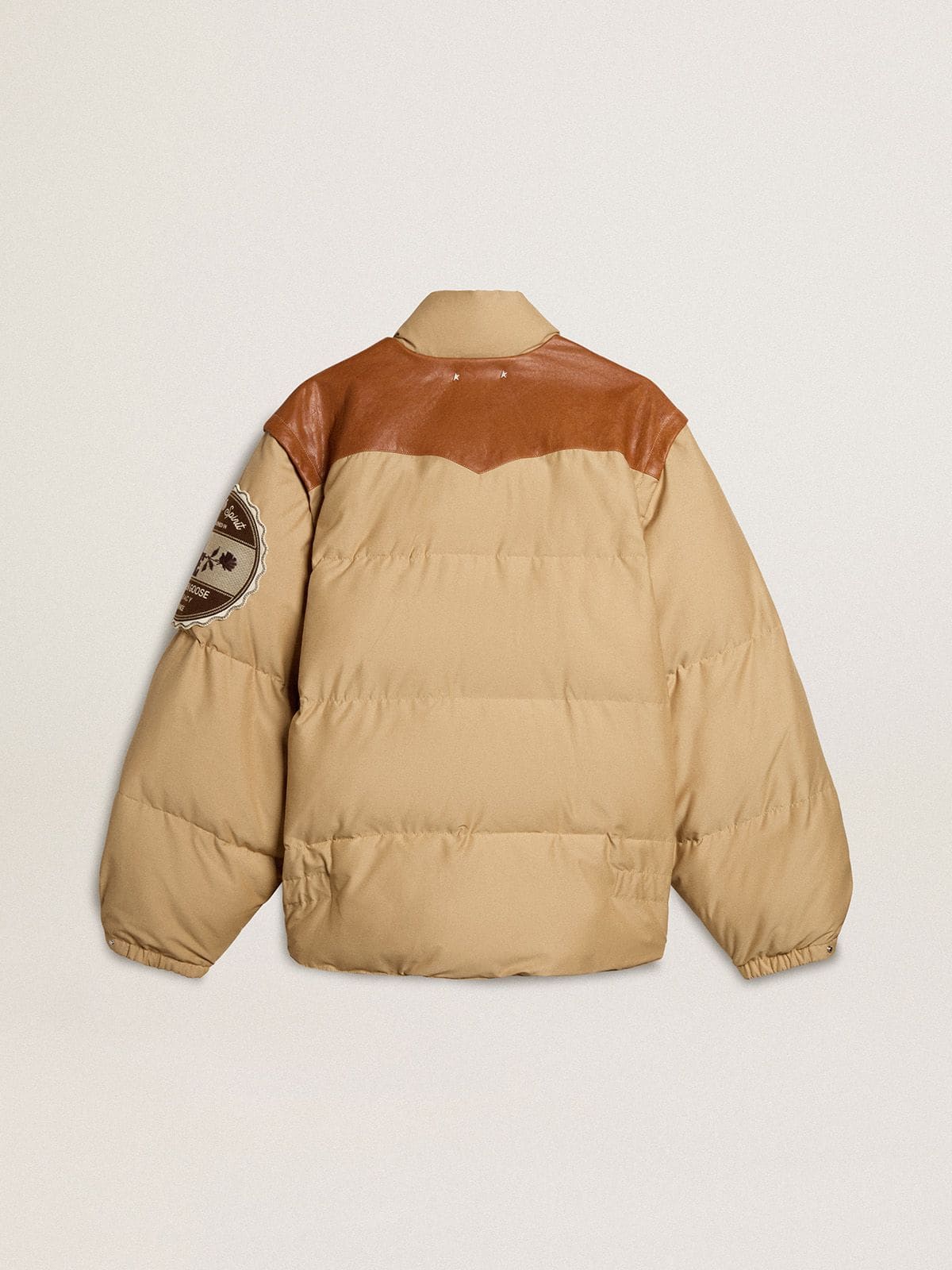 Beige bomber jacket with leather and patch details