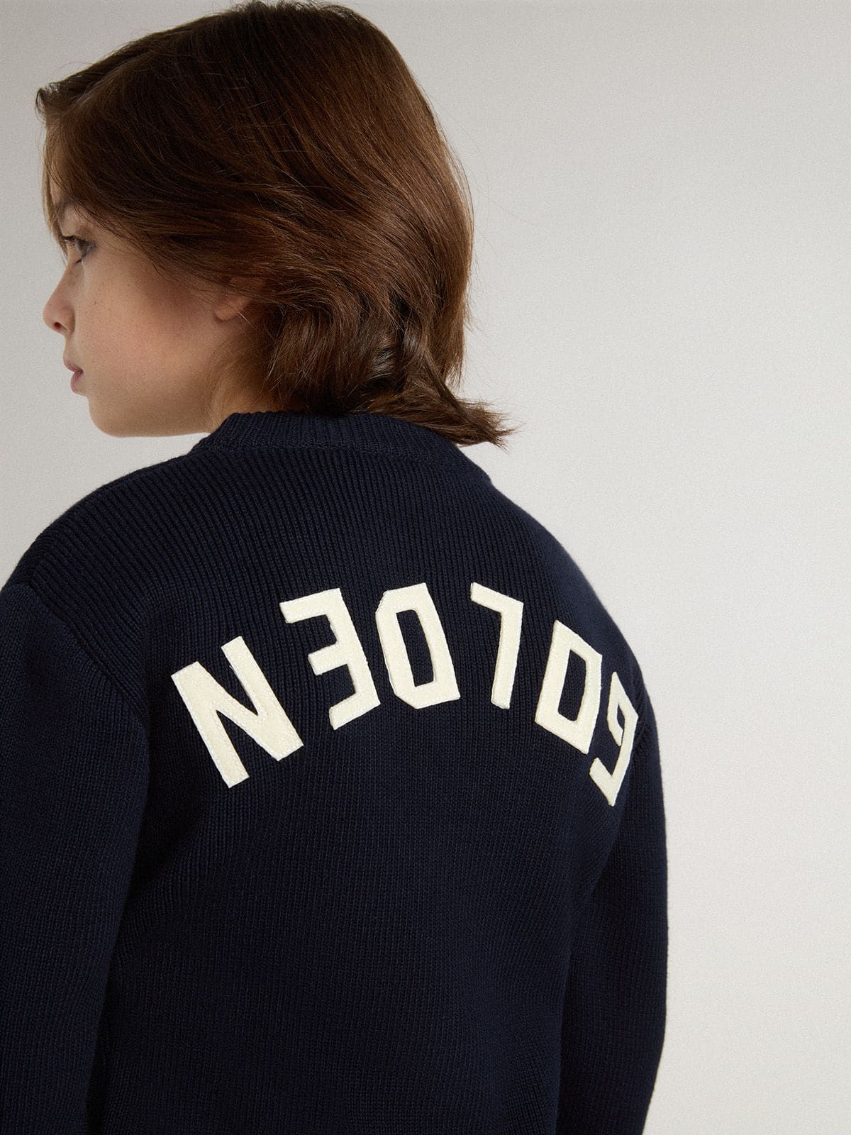 Boys’ blue crew-neck sweater with 'Golden' lettering on the back