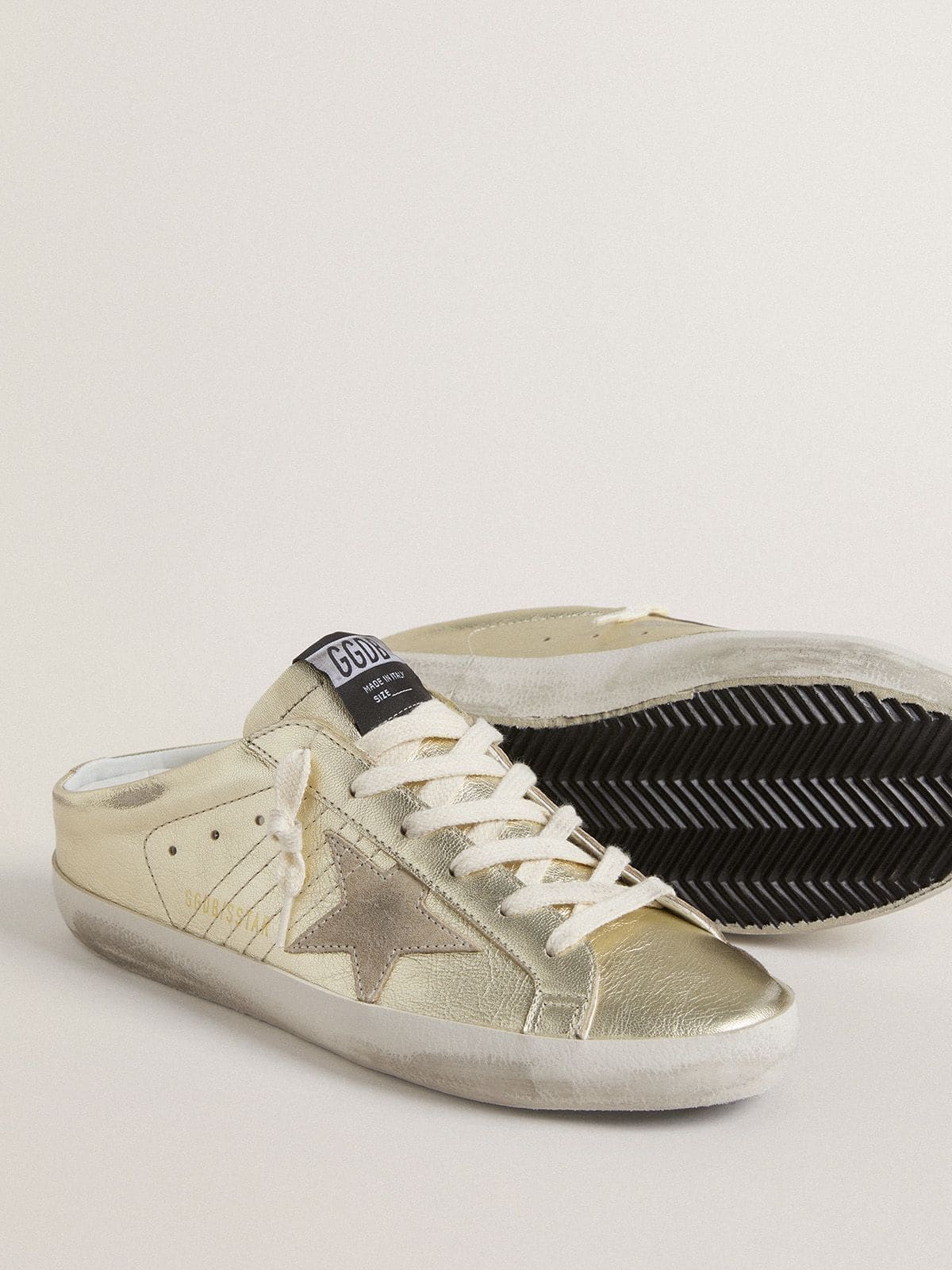 Super-Star Sabots in platinum foiled leather with beige suede star