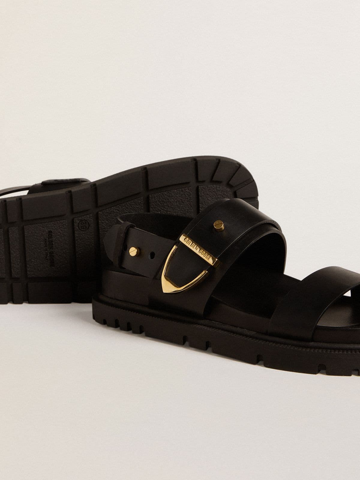 Women's Lucy sandal in glossy black leather with gold metal buckle