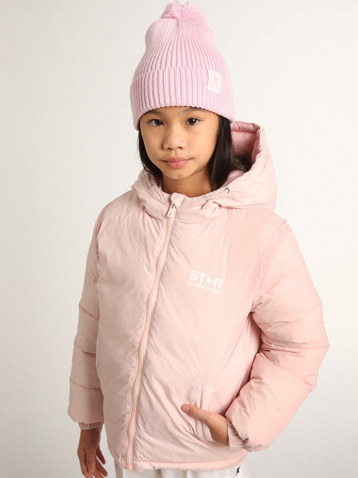 Pink padded jacket with hood and white maxi star on the back