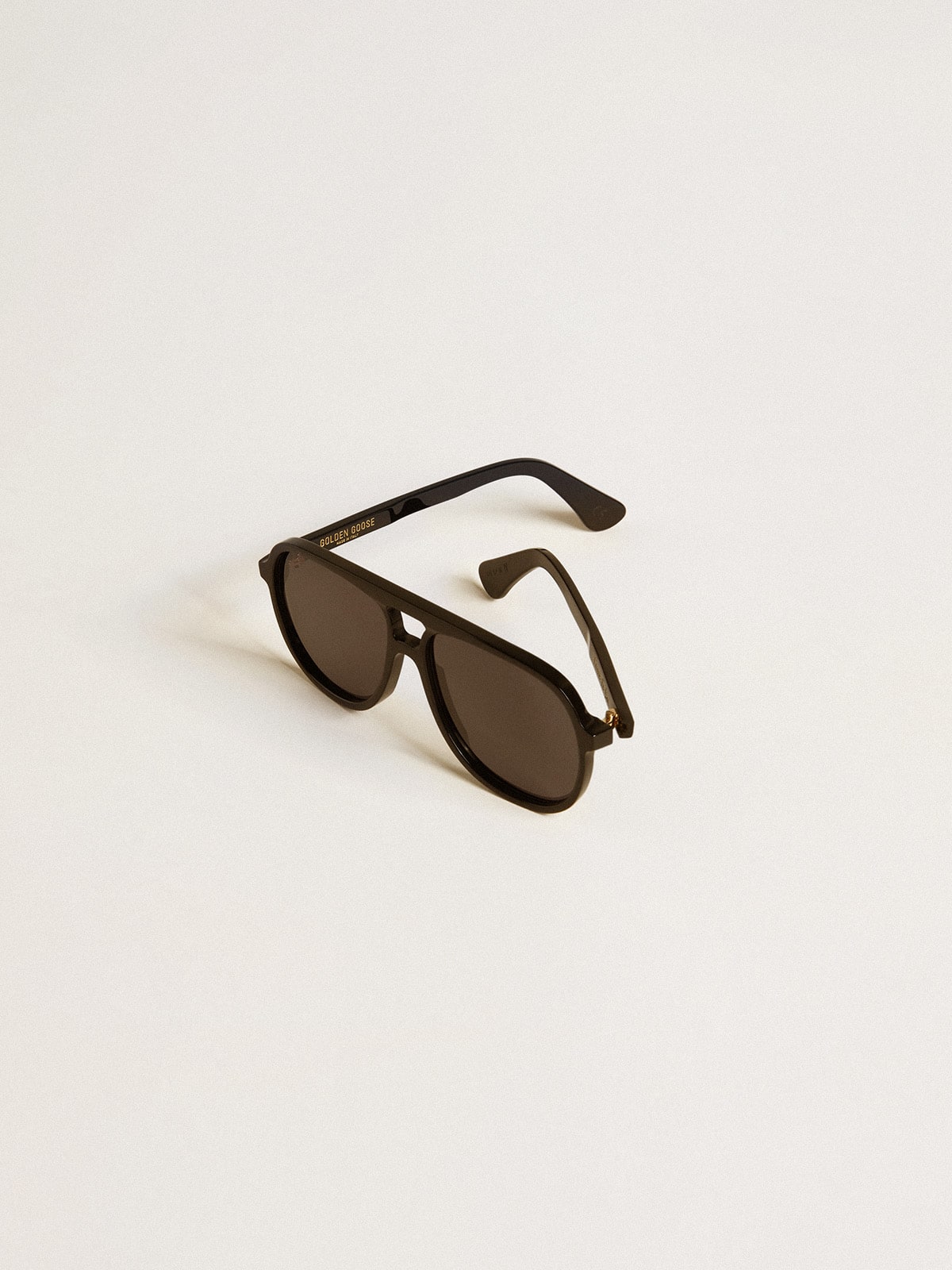 Aviator style sunglasses with black frame and lenses