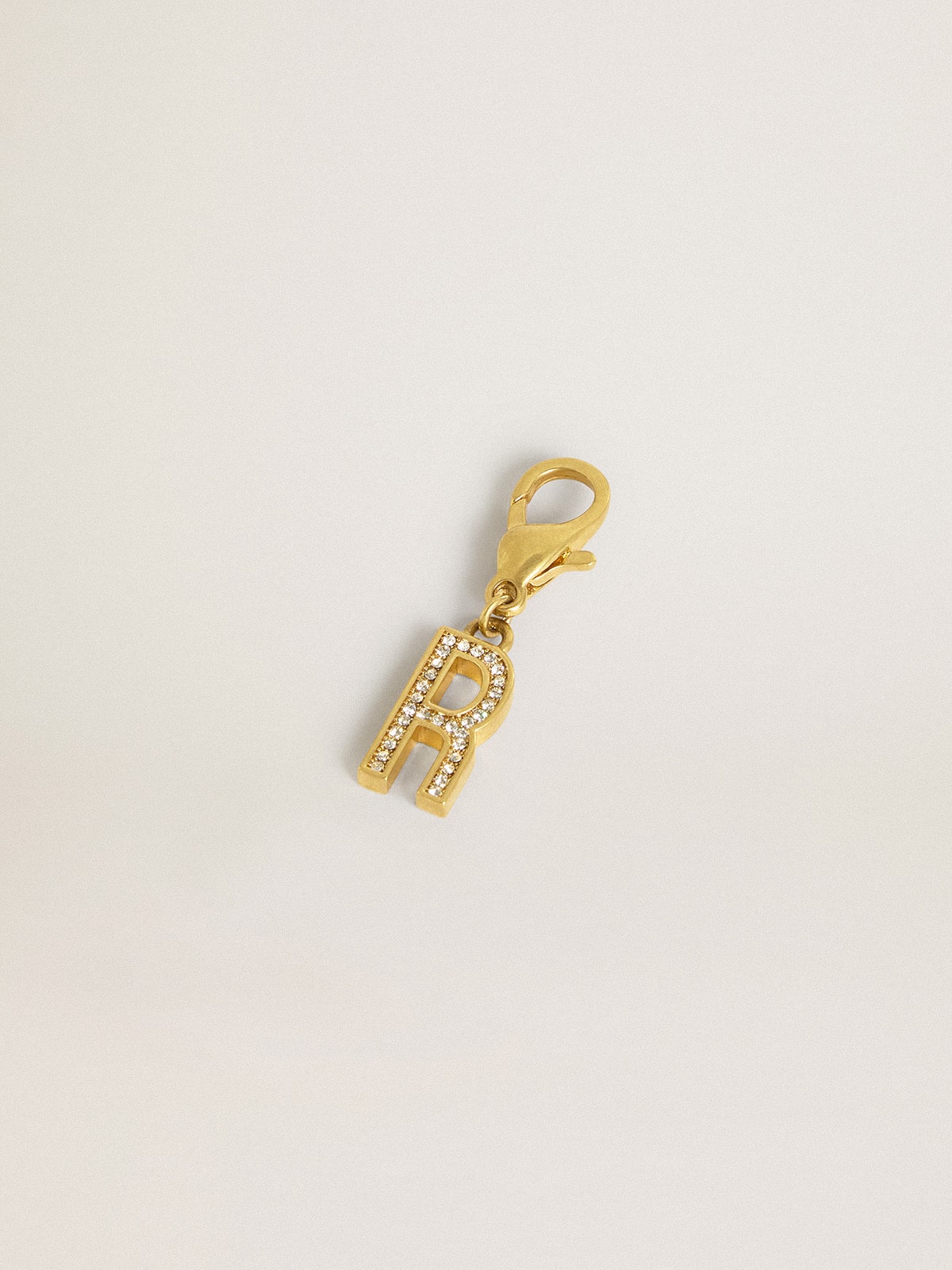 Letter R charm in gold-colored brass with crystals