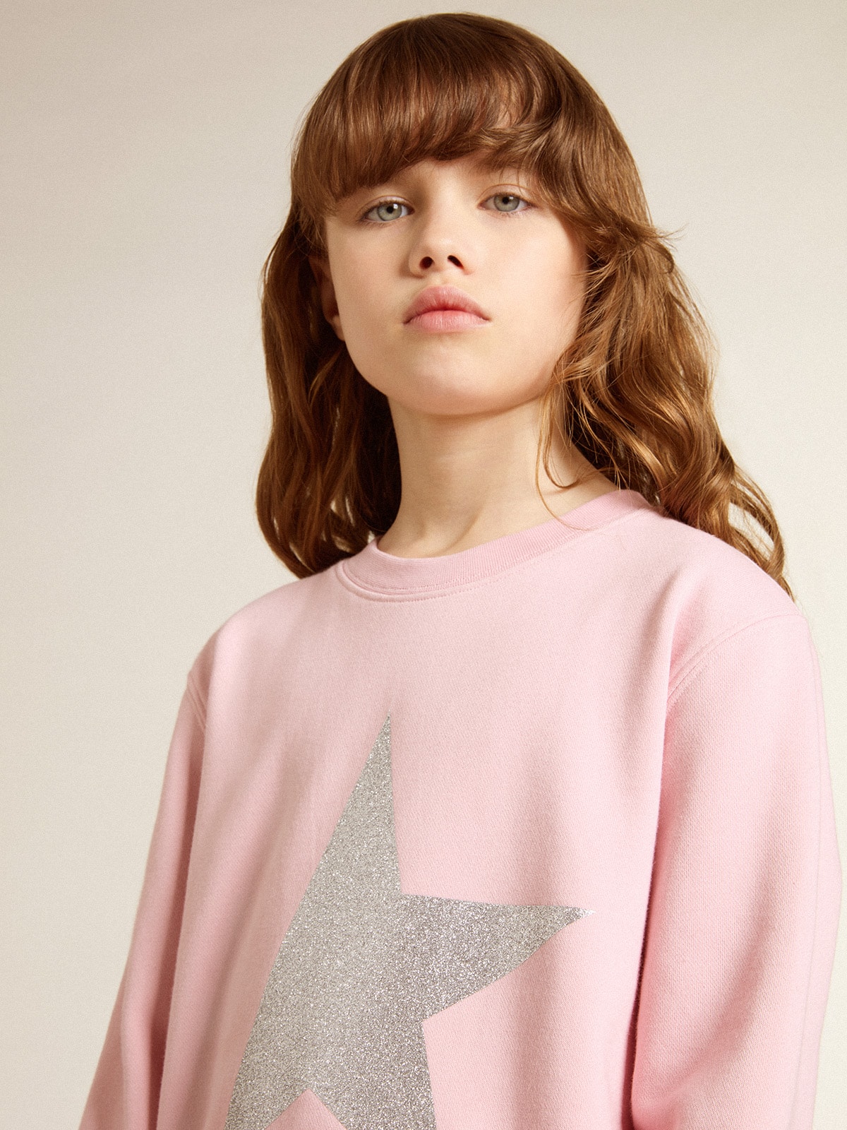 Pink sweatshirt with maxi star in silver glitter on the front