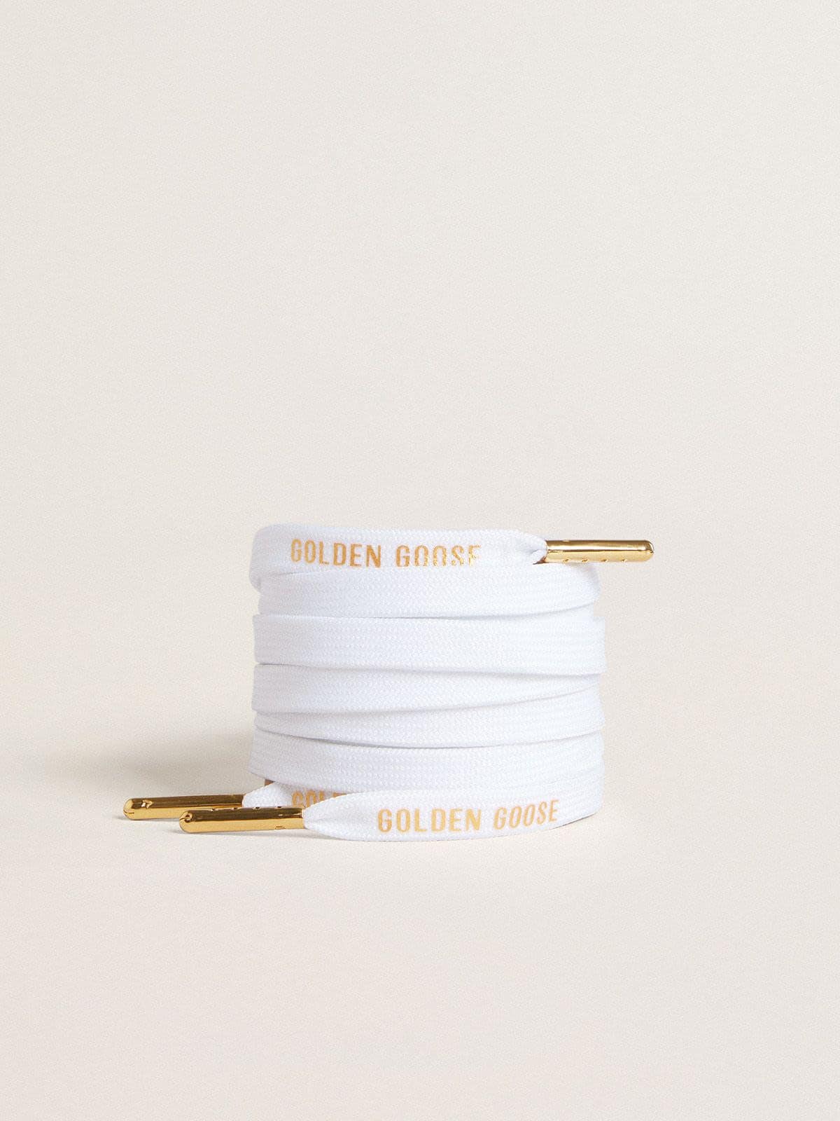 White cotton laces with contrasting gold logo