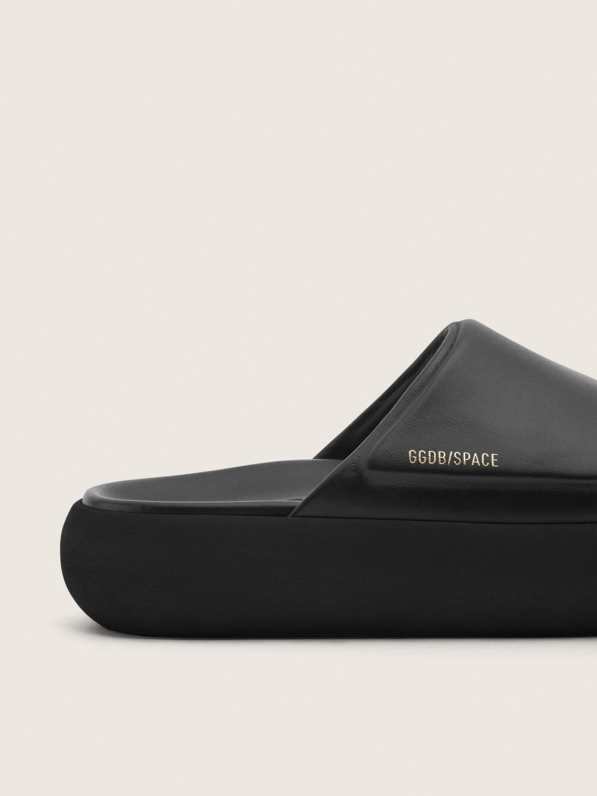 Women's Space-Star Slide slip-ons in black leather