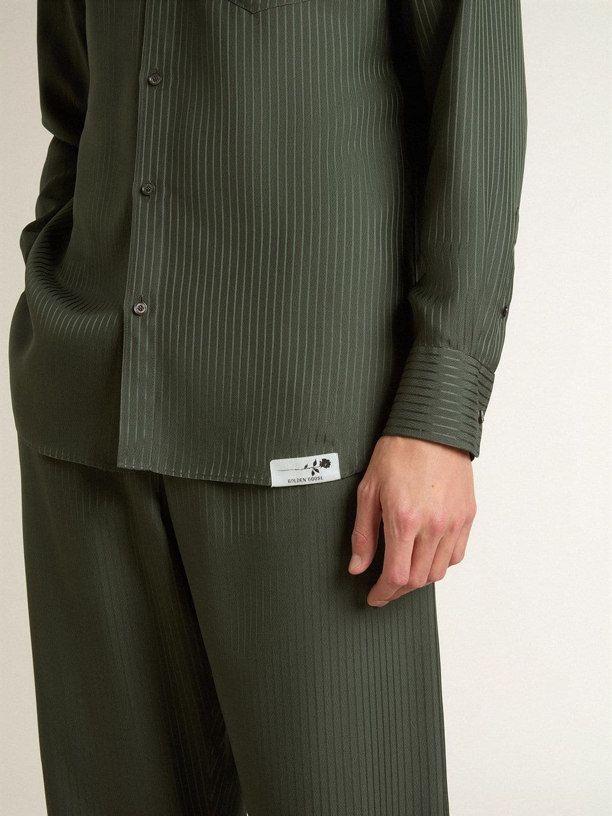 Men's dark green shirt with vertical stripes