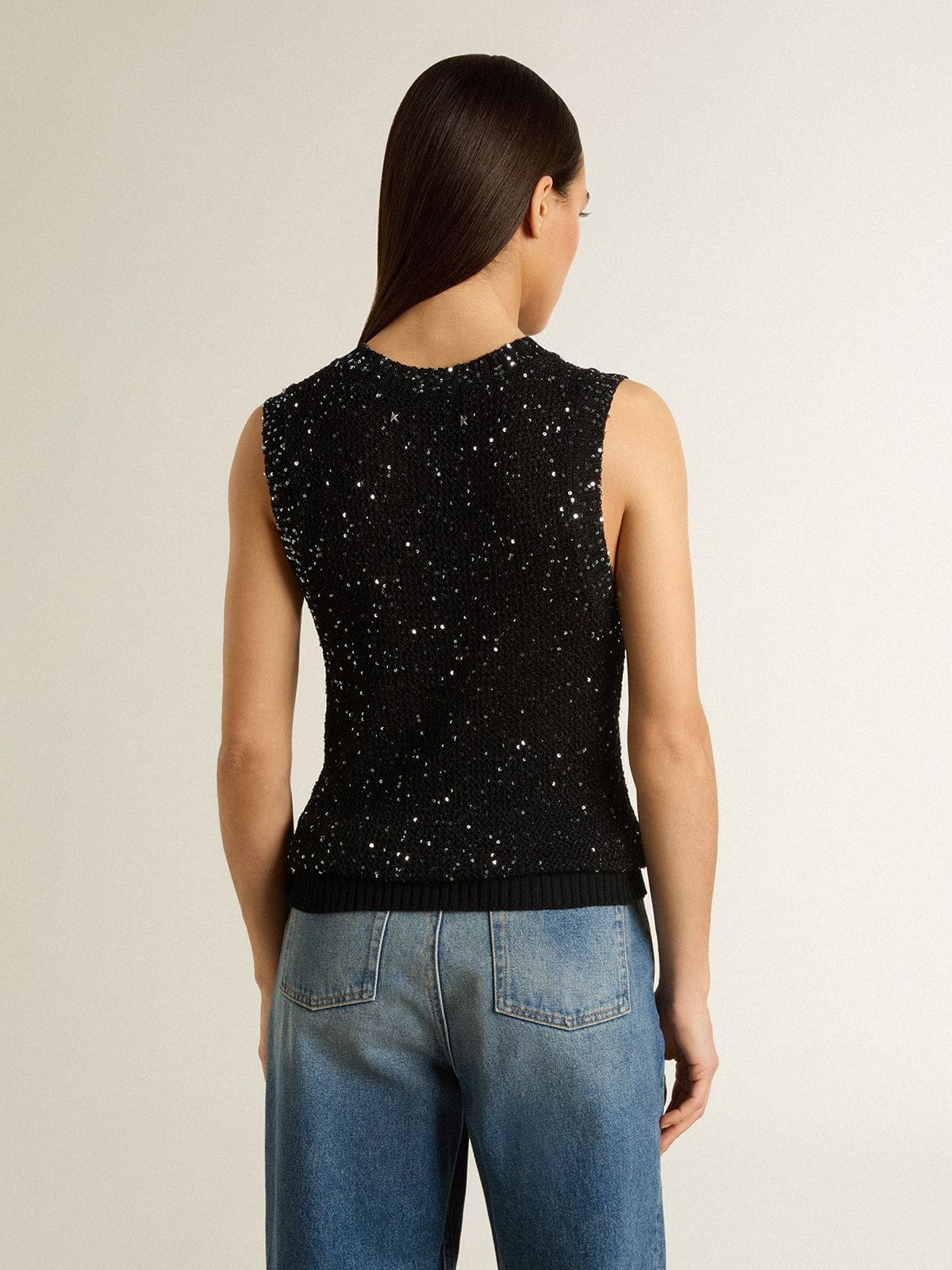 Black mesh knit top with sequins and contrasting details
