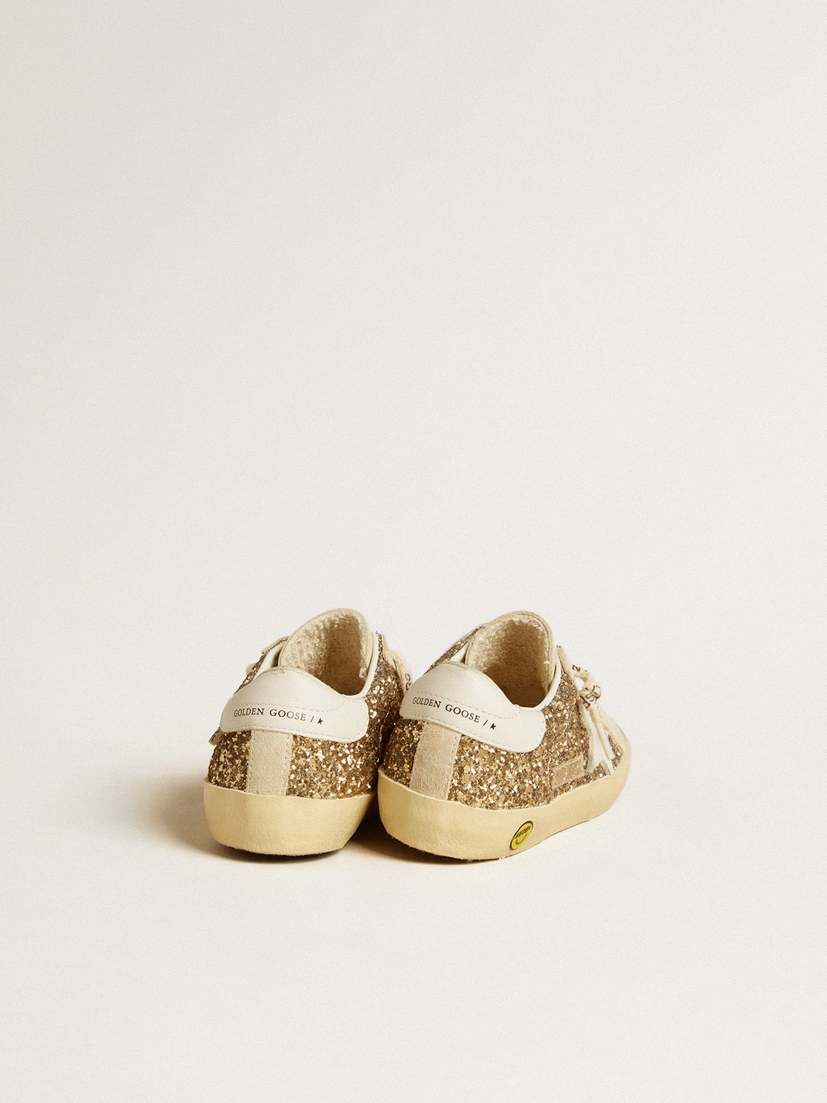 Super-Star Young in gold glitter with white leather star and heel tab