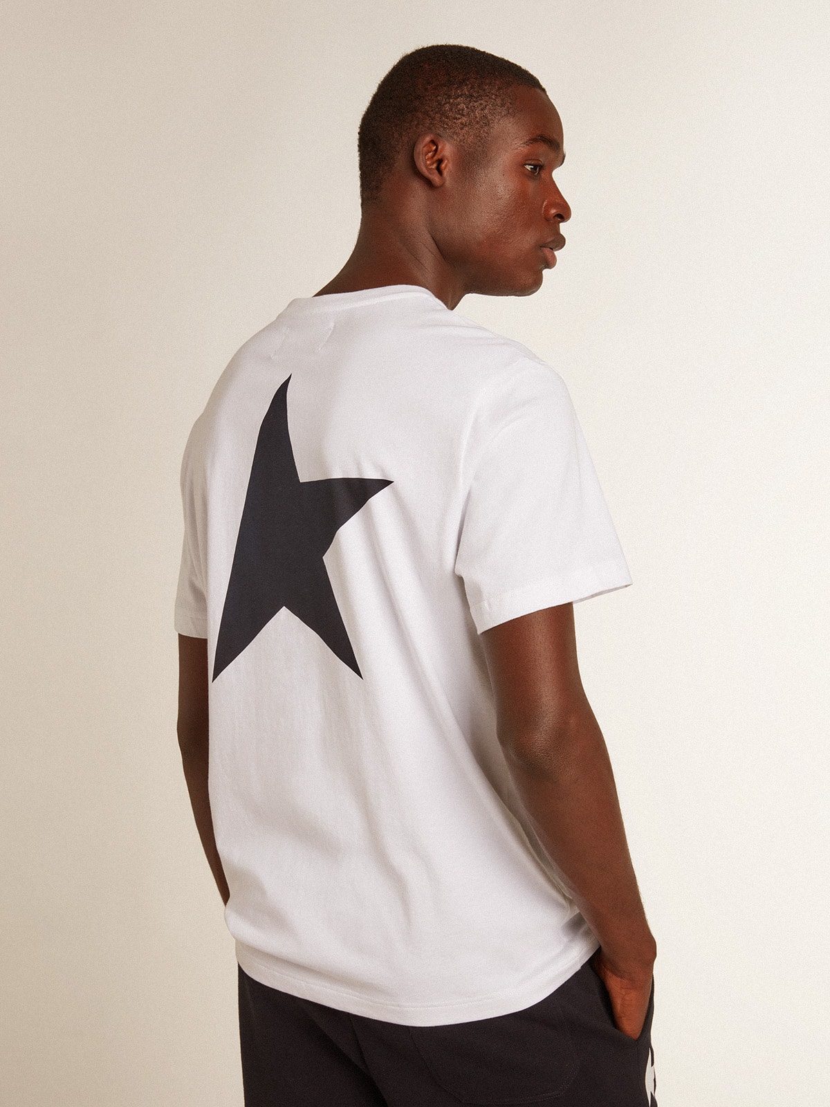 Men’s white T-shirt with dark blue star on the back