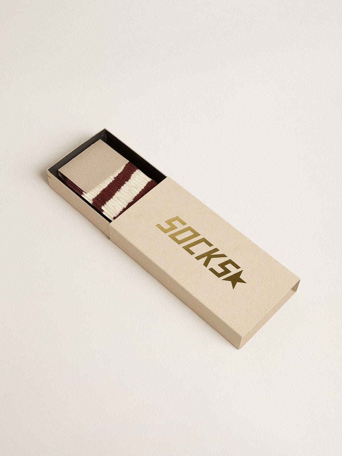 Brown socks with distressed details and worn-white stripes