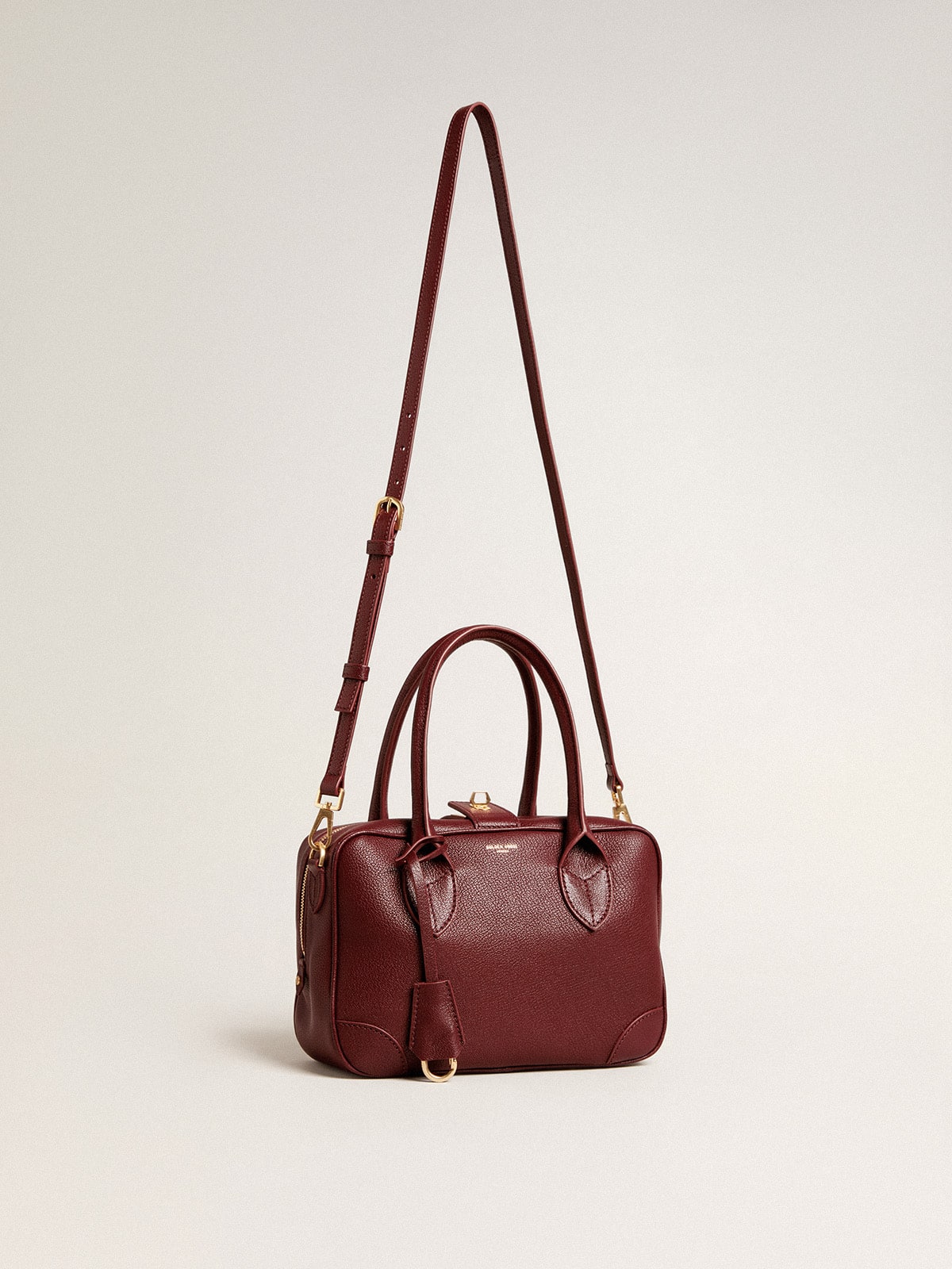 Vita Bag in burgundy leather with gold details