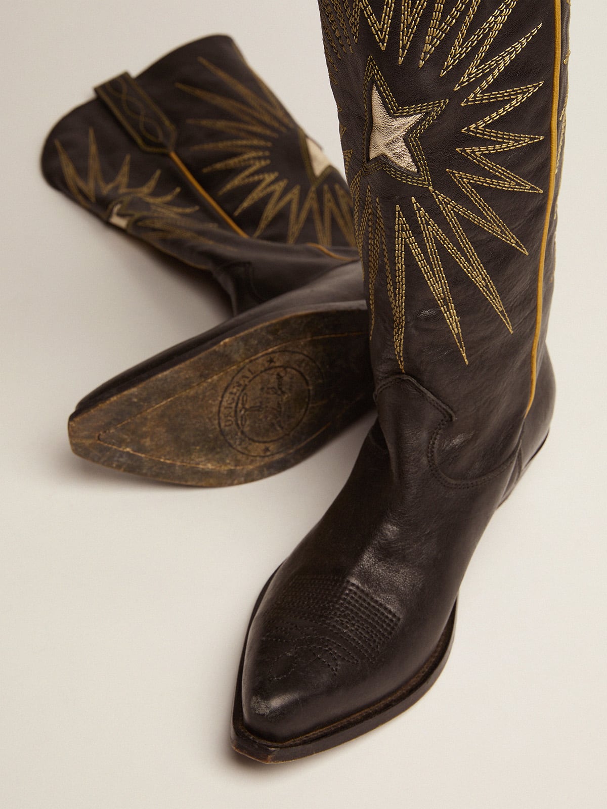 Wish Star boots in black leather with platinum laminated leather inlay star