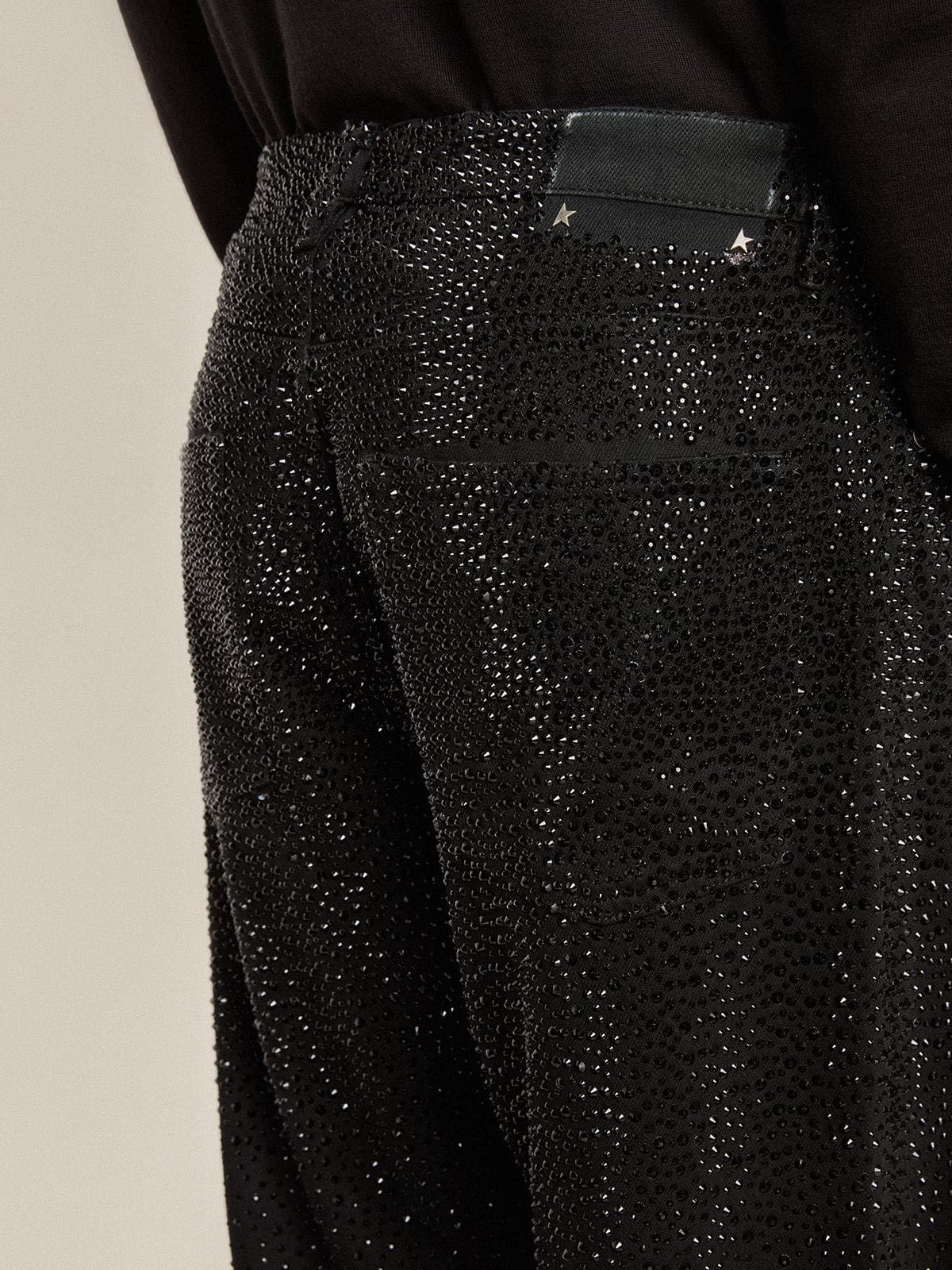 Men's black jeans with a loose fit and gradient effect all-over crystals