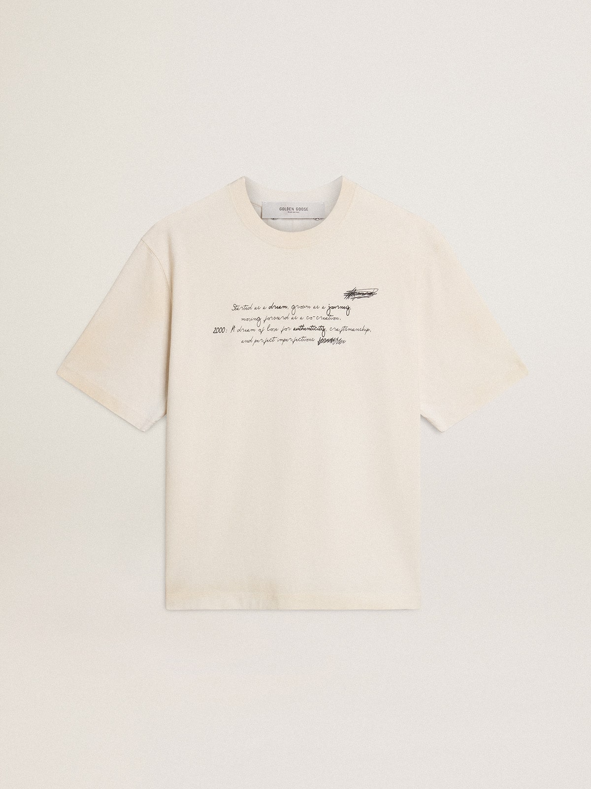 Worn-white unisex T-shirt with printed lettering